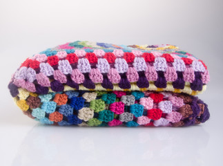 blanket or crochet blanket on a background new.