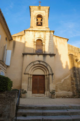 Fototapeta na wymiar Editorial. Lourmarin. Provence. France. October 27. 2019. Village church at sunset golden hour. Provence tourism.. 