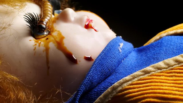 Ugly retro doll with worms on it. Despair and fear concept.