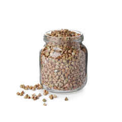 Organic green buckwheat in glass jar isolated on white