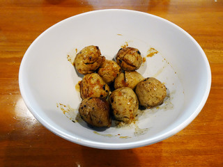 Grilled meatballs in white bowl