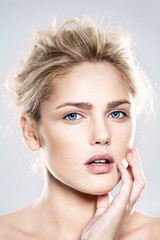 close-up portrait of beautiful model with natural make-up, shooted on blue background - 305644357