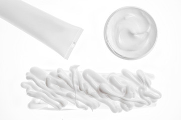 The jar packaging for hygienic cream and texture cream foam, white background. Moisturizing your hands.