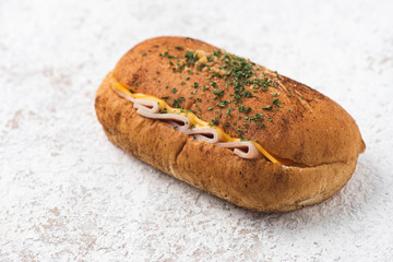 bread ham cheese on white backdrop