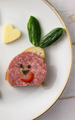 . Food art hare shaped meat, bread and vegetable funny creative idea free space for text - holidays, winter, celebration