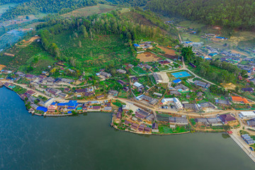 Obraz premium Aerial landscape of Ban Rak Thai with sunrise in the morning located in Maehongsan province, Thailand.