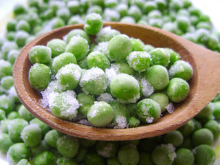Natural background of many fresh organic green peas. Frozen green peas.