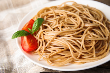 Plate of tasty buckwheat noodles on table, closeup