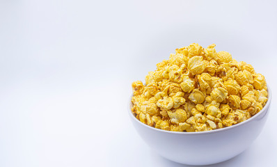 Delicious popcorn with caramel in bowl on.white color background