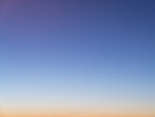 Gradient sky in sunset time with orange to baby blue color / gradient effect / background concept / sky texture