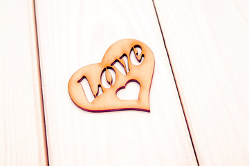 A symbol of love on white wooden background