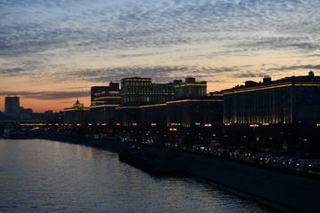 sunset on the river in the city