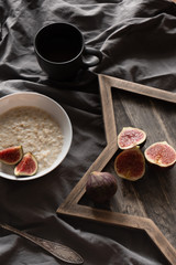 porridge with figs. Healthy breakfast ingredients. vegan food concept