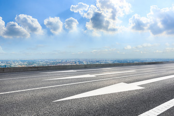 Fototapeta premium Asphalt highway and city skyline with clouds scenery in Shanghai.