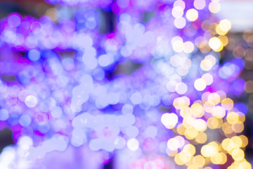 Abstract composition, blurred purple yellow white blue lights bokeh background