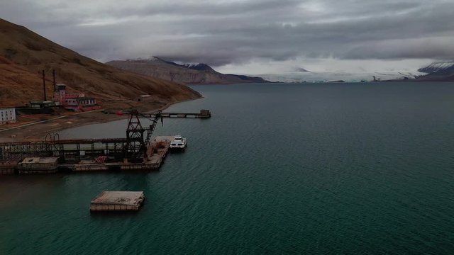 Flying Over The Barentsburg In Svalbard, Norway On A Cold Cloudy Day - Aerial Shot