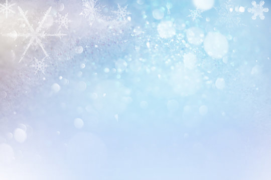 Merry Christmas background with snowflakes and glitter. Festive holiday abstract.