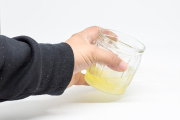 man with glass of limoncello or lemon liqueur in hand