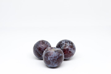 freshly caught tree plum on white background