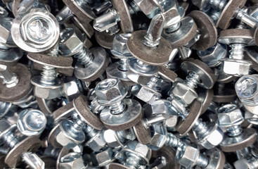 Obraz premium small screws in a box for background