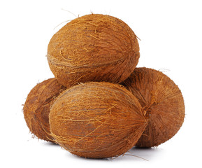 Whole coconut close up isolated on white background