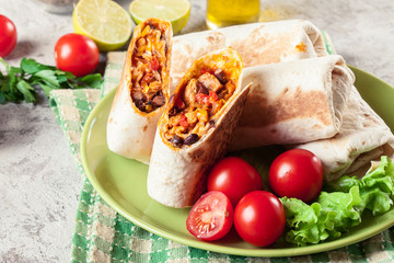 Burritos wraps with mincemeat, beans and vegetables