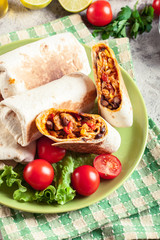 Burritos wraps with mincemeat, beans and vegetables