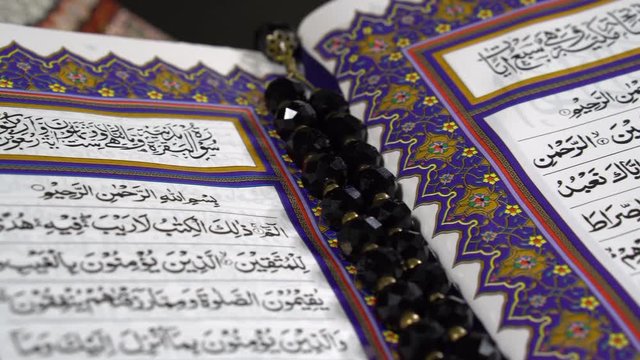Track shot of Muslims Holy Book Quran Al Kareem Quran Majid Quran Hakeem 4k