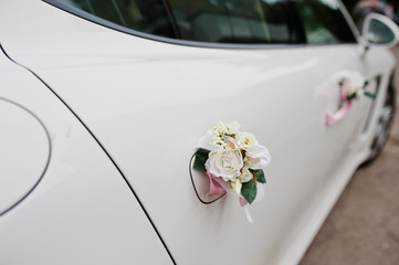 Elegance wedding limousine car with floral decoration.