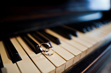 Fototapeta na wymiar Wedding day. Accesories for wedding preparation. Wedding rings in piano.