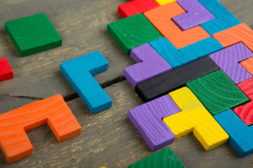 Creative solution for idea - business concept, jigsaw puzzle on the wooden desk