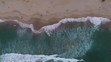 beautiful Indonesian beach with brown sand and blue sea water
