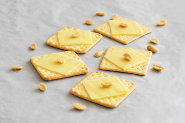 Crackers with cheese and peanuts. Selective focus. 