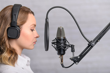 Speech recording on radio stations, the announcer works in the studio with a studio microphone