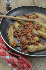 braised endives with bacon in a dish