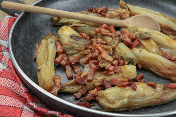 braised endives with bacon in a dish