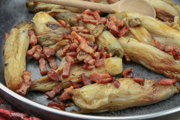 braised endives with bacon in a dish