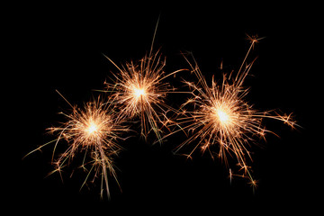 Three sparklers firework on black background. Christmas celebration.