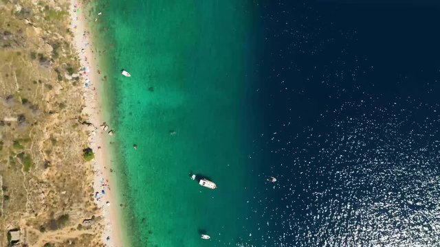 High angle aerial drone footage in a bay in Vruja, Croatia. Flying above and following the coastline.
