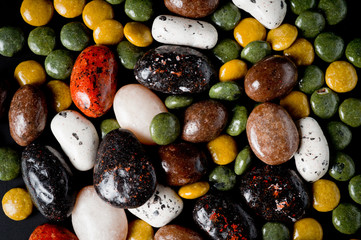 .Pebble-dragee with apricots, chocolate, mandarin and marzipan.