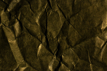 Black craft background crumpled paper. Recycled paper background.