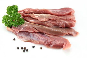 duck breast raw and cut on a white background