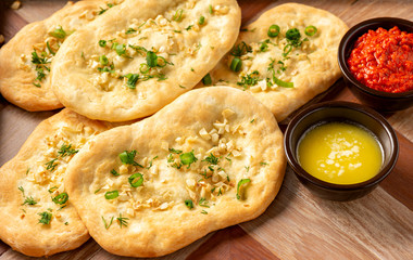 Homemade naan bread with garlic and butter.