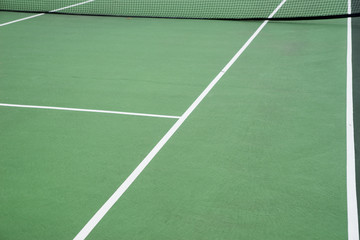View of a green tennis court. Side line of the tennis court