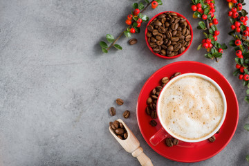 Obraz na płótnie Canvas Cappuccino or latte with milk foam in a red cup