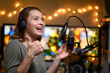 The blogger works with a studio microphone, podcasts, voice acting, audio books
