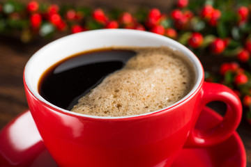 Delicious brazilian arabica coffee in red cup with berries