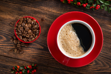 Delicious brazilian arabica coffee in red cup with berries