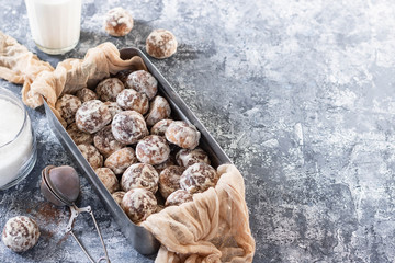 Chocolate mini gingerbread cookies in a tin retro box.