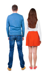 Back view of couple. beautiful friendly girl and guy together.